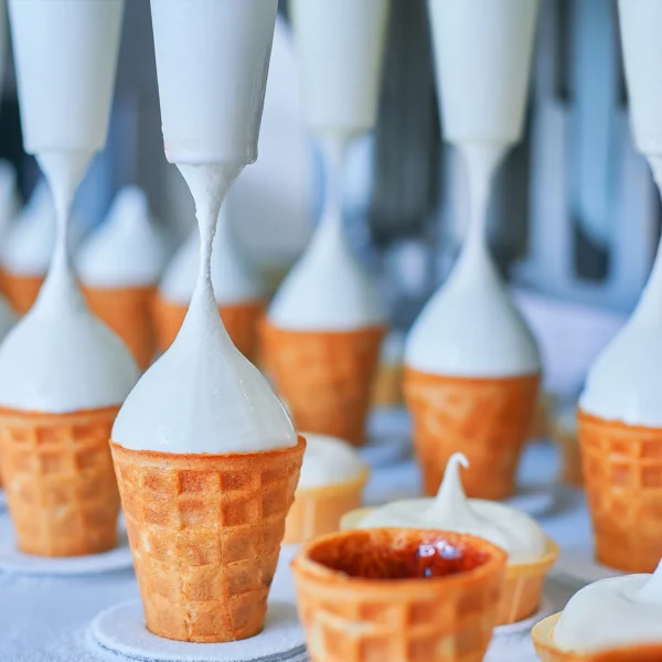 a photo of ice cream being pumped